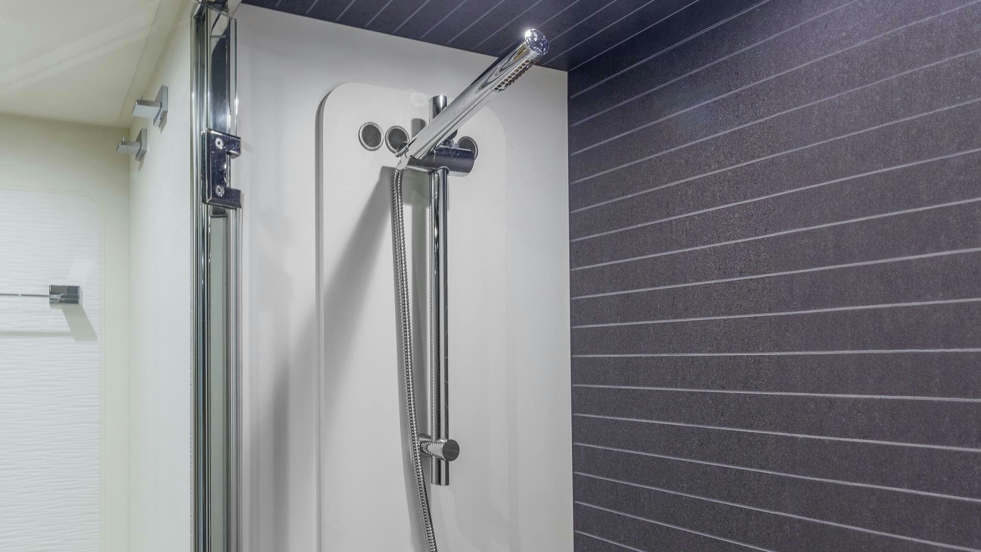 a shower unit with a shower head aboard DEVENZO Yacht for Sale