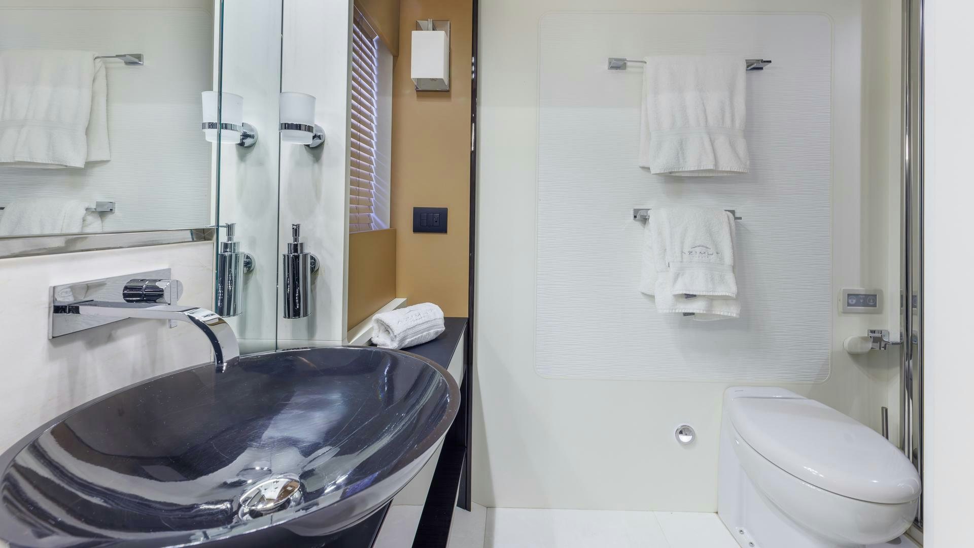 a bathroom with a sink and toilet aboard DEVENZO Yacht for Sale