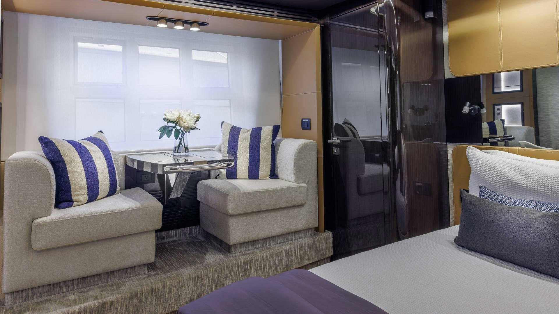 a room with a bed and a desk aboard DEVENZO Yacht for Sale