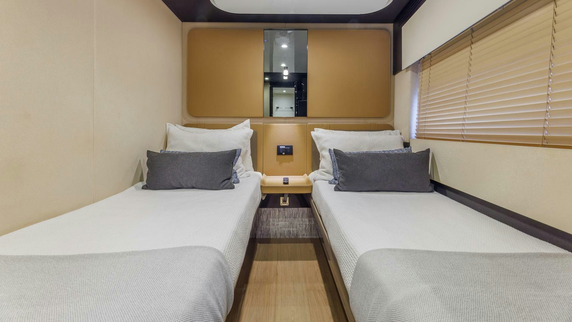 a room with two beds aboard DEVENZO Yacht for Sale