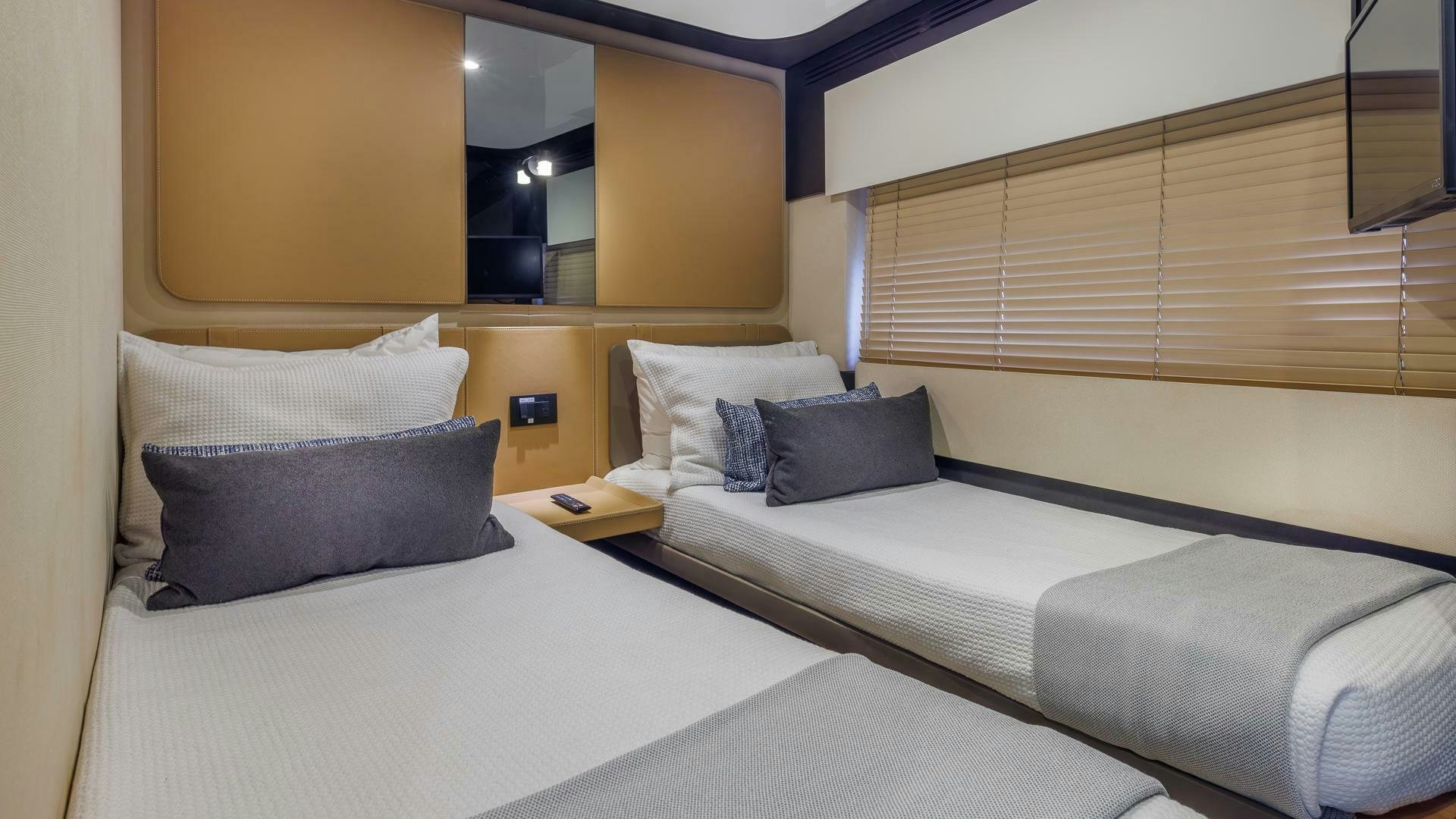 a room with two beds aboard DEVENZO Yacht for Sale