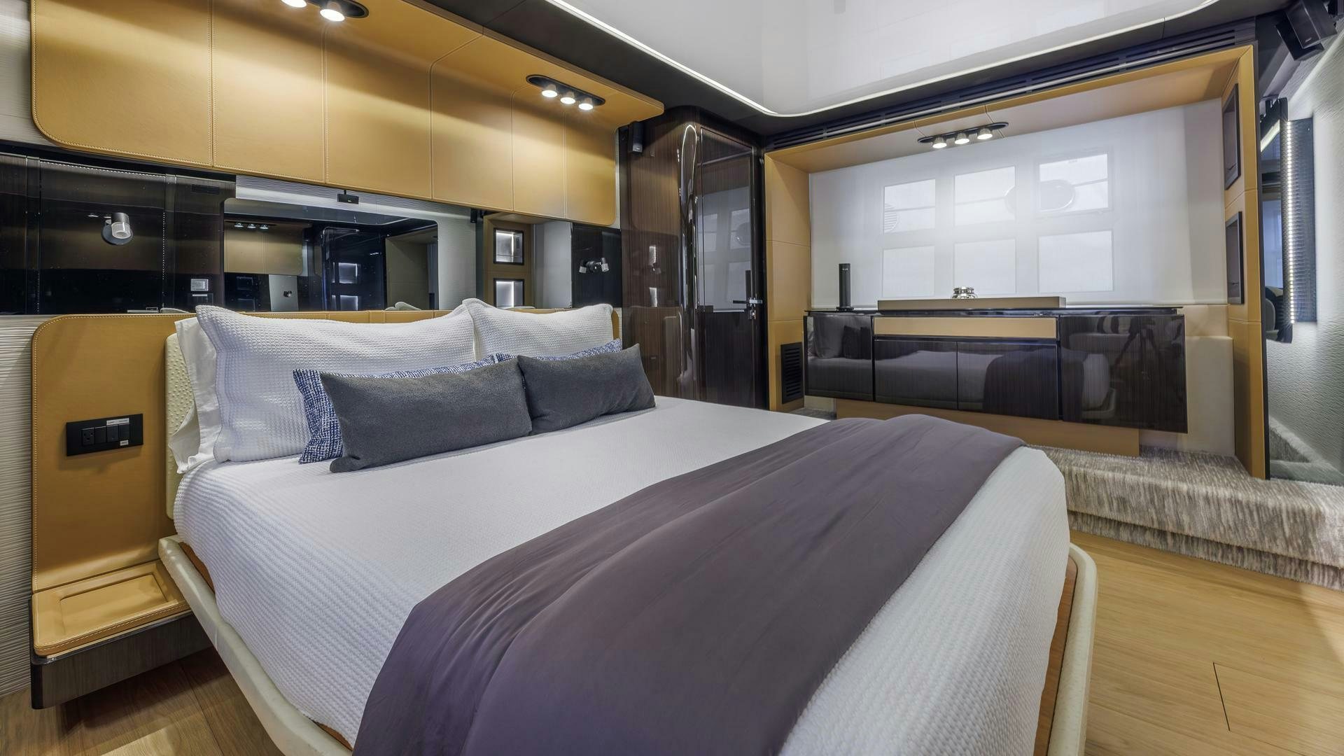 a room with a bed and a desk aboard DEVENZO Yacht for Sale