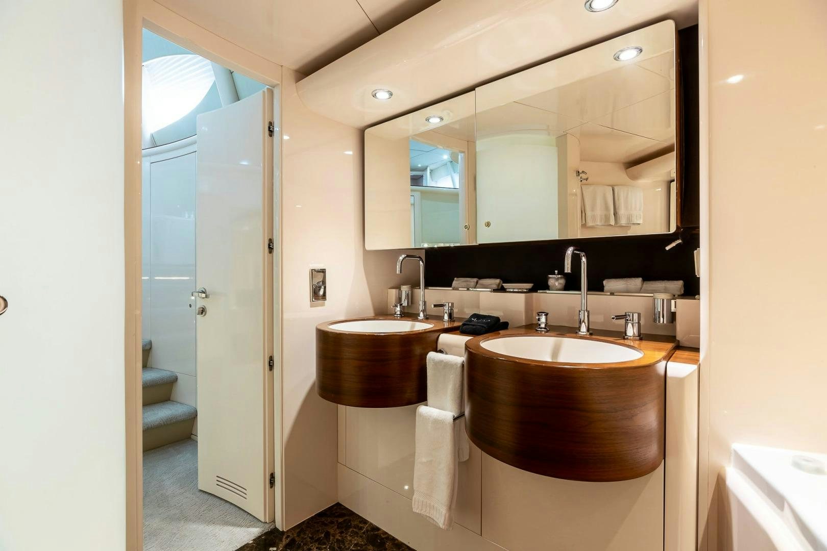 a bathroom with a large mirror aboard GRANDEUR Yacht for Sale