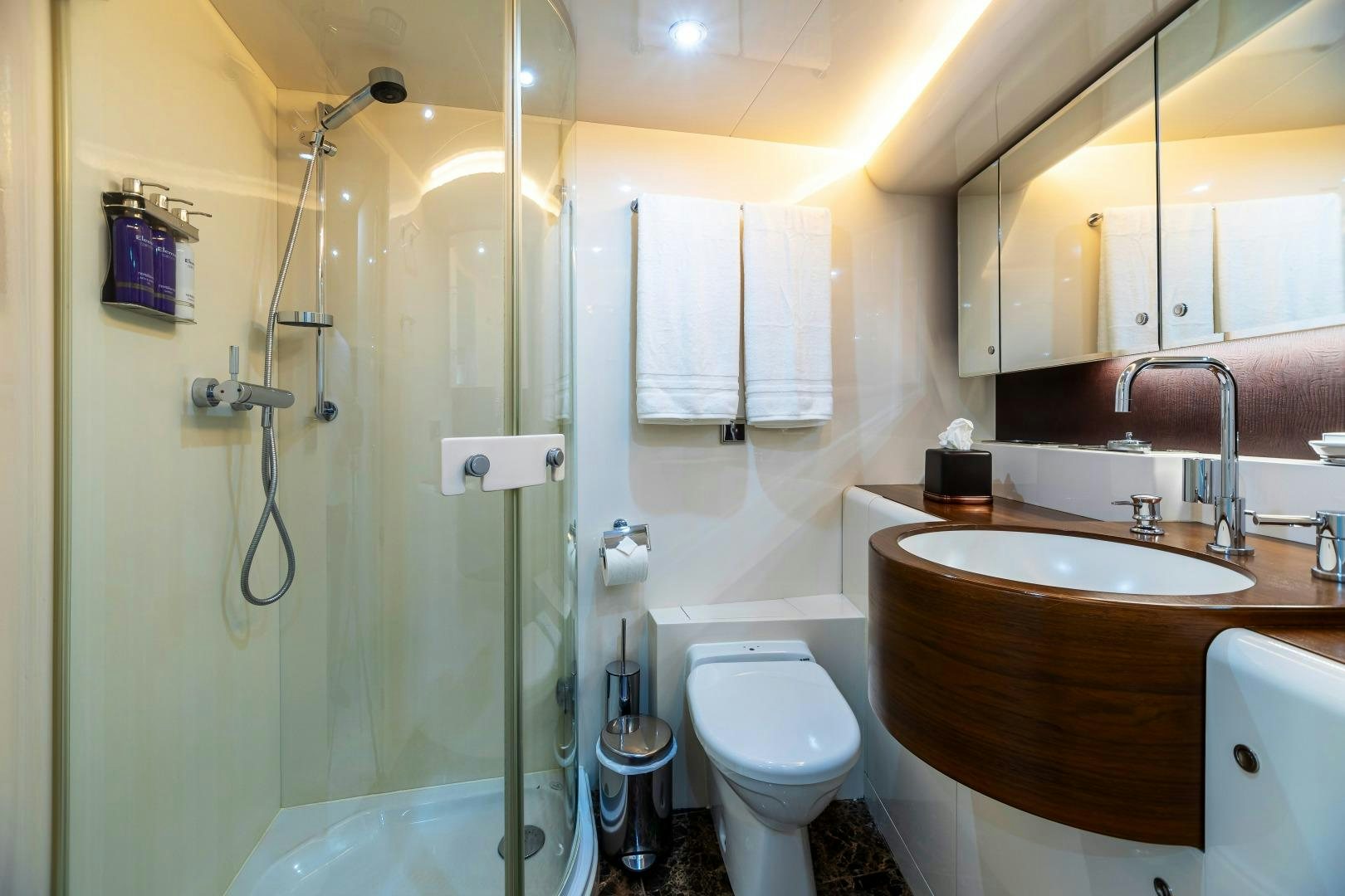 a bathroom with a glass shower aboard GRANDEUR Yacht for Sale