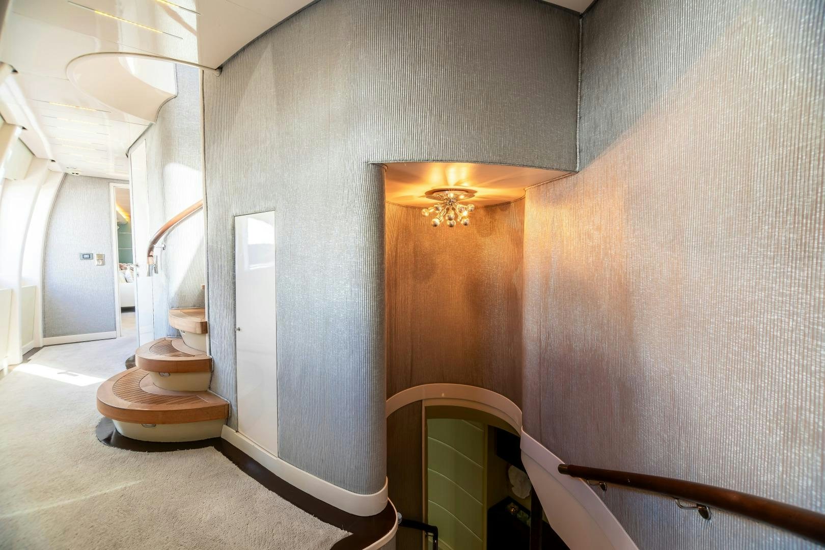 a room with a staircase and a wood door aboard GRANDEUR Yacht for Sale