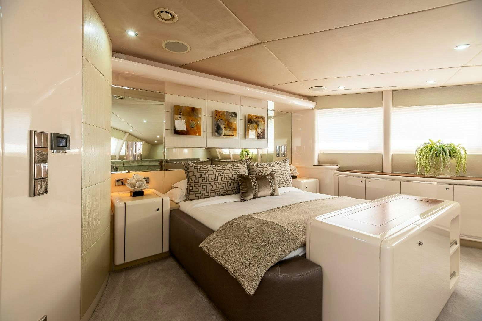 a bedroom with a bed and a desk aboard GRANDEUR Yacht for Sale