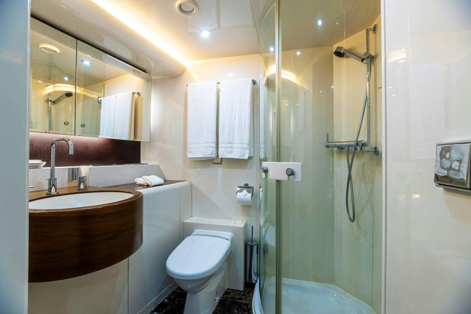 a bathroom with a glass shower aboard GRANDEUR Yacht for Sale