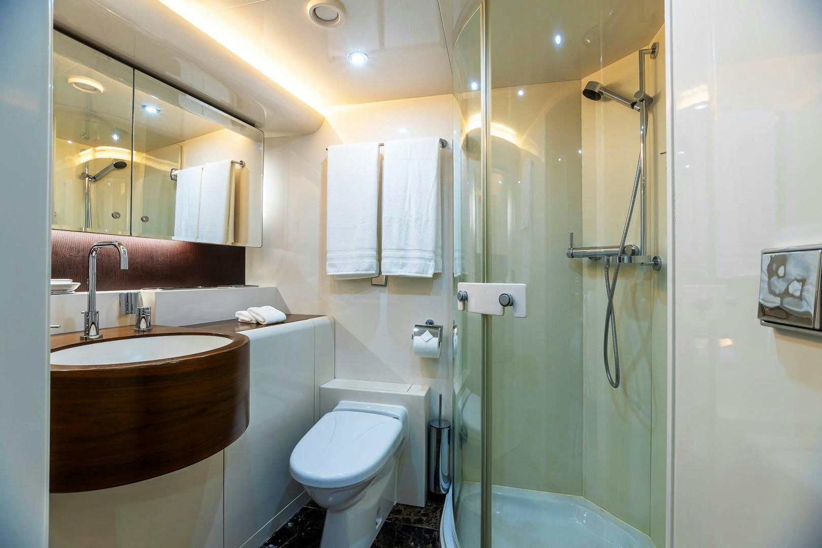 a bathroom with a glass shower aboard GRANDEUR Yacht for Sale