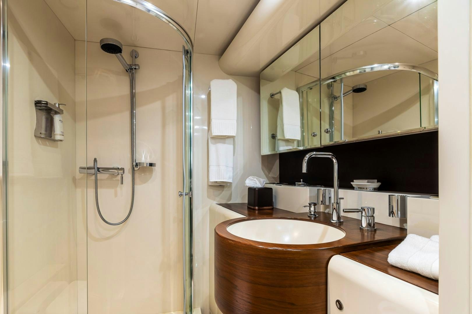 a bathroom with a glass shower aboard GRANDEUR Yacht for Sale