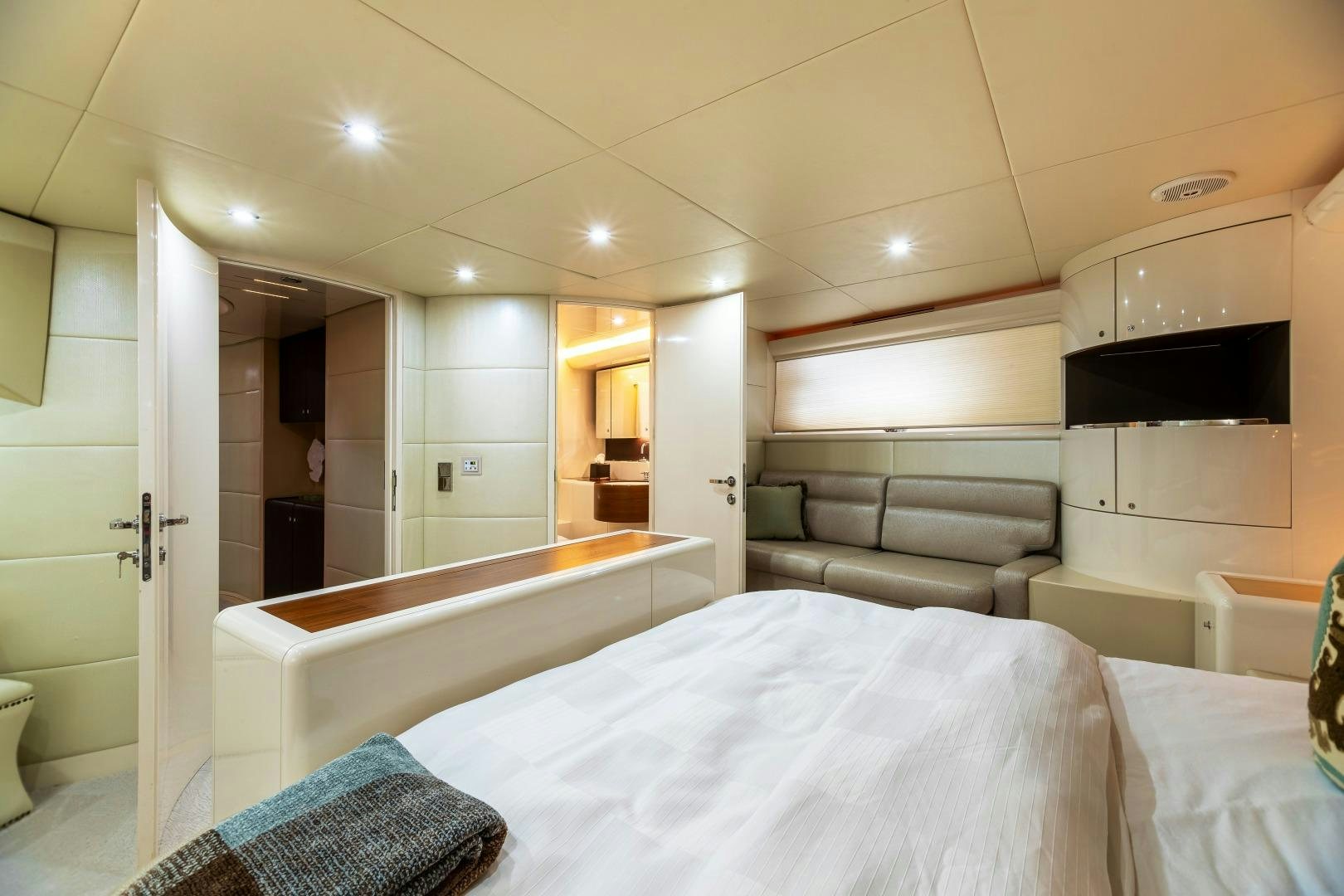 a large bedroom with a bed aboard GRANDEUR Yacht for Sale