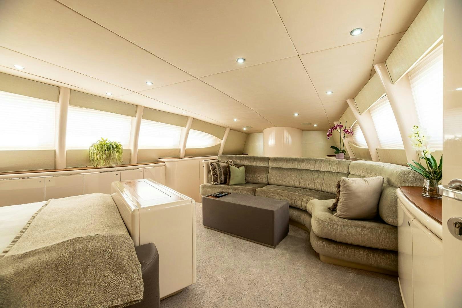 a room with a couch and a bed aboard GRANDEUR Yacht for Sale