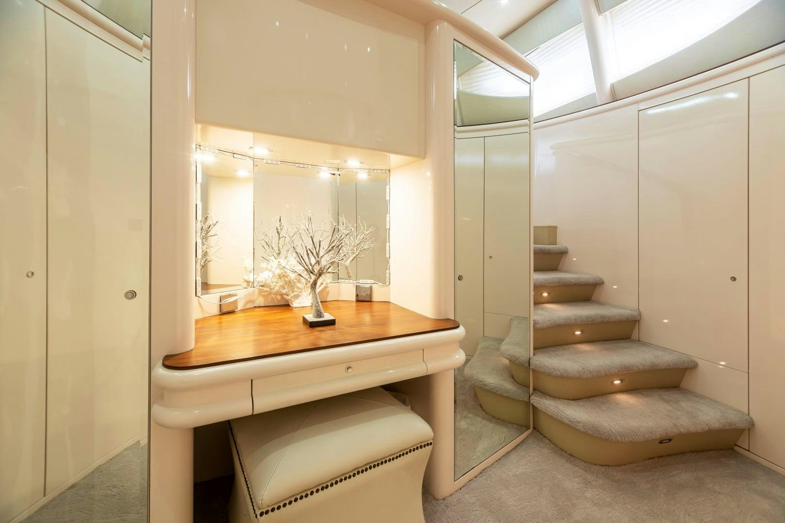 a room with a table and a bench aboard GRANDEUR Yacht for Sale