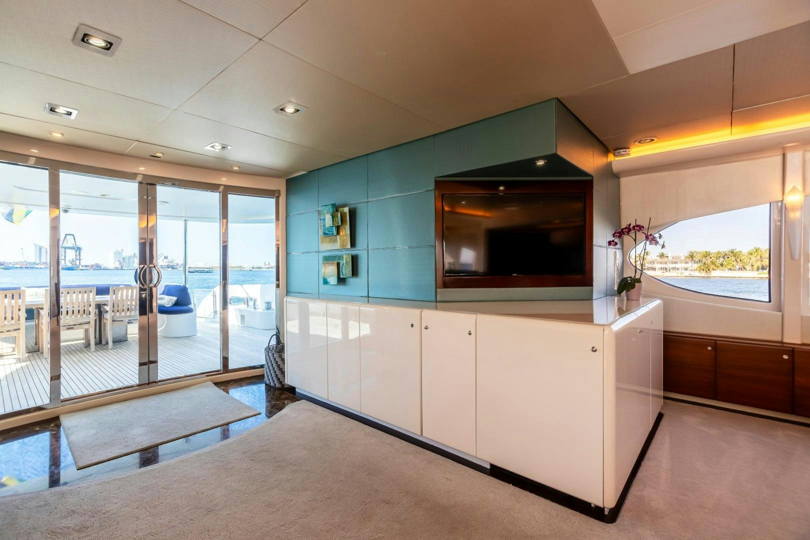 a room with a large window and a large tv aboard GRANDEUR Yacht for Sale