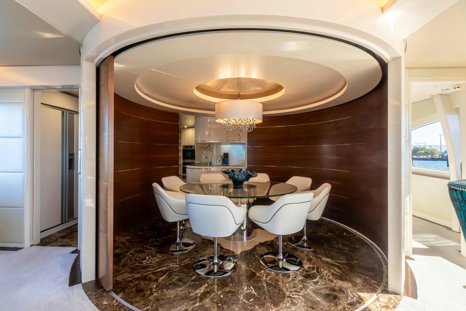 a room with a table and chairs aboard GRANDEUR Yacht for Sale