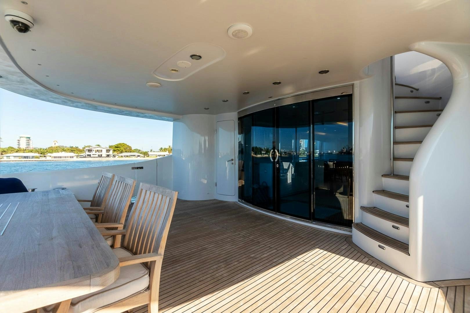 a room with a table and chairs aboard GRANDEUR Yacht for Sale