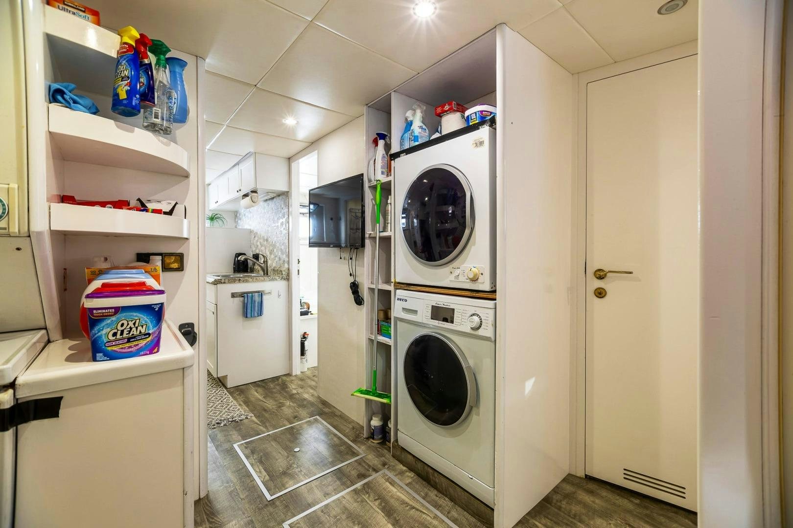 a laundry room with a washer and dryer aboard GRANDEUR Yacht for Sale