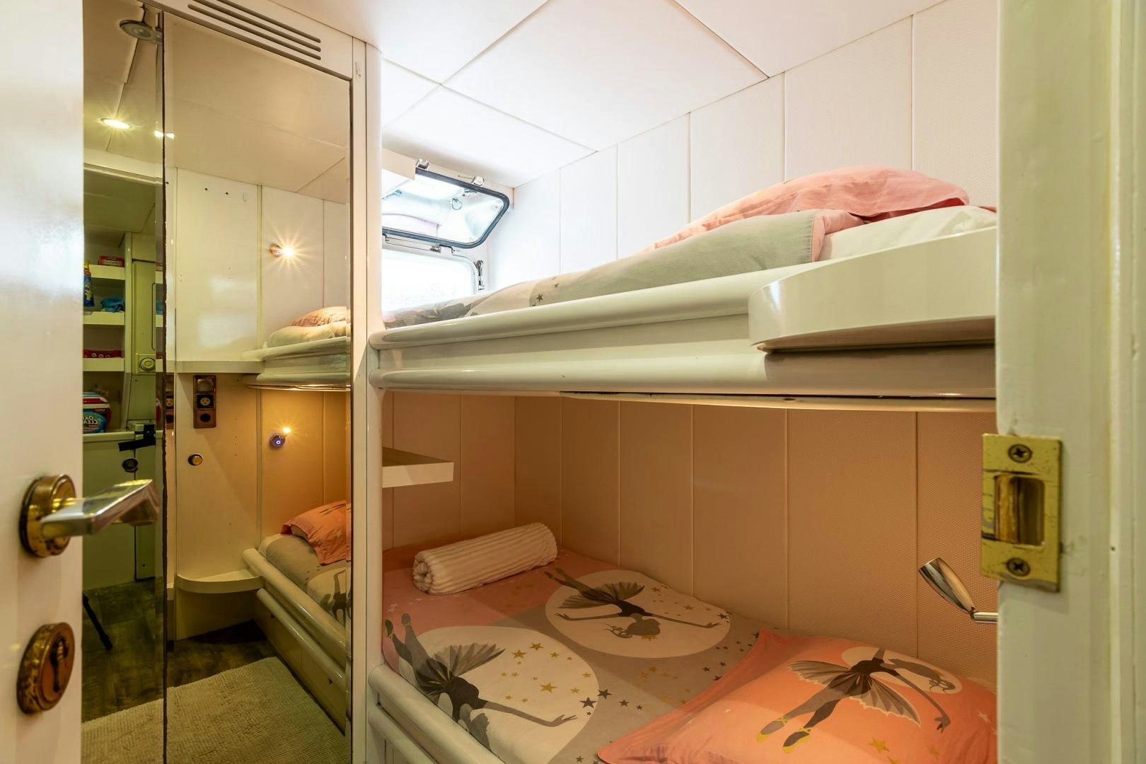 a room with a bed and a mirror aboard GRANDEUR Yacht for Sale