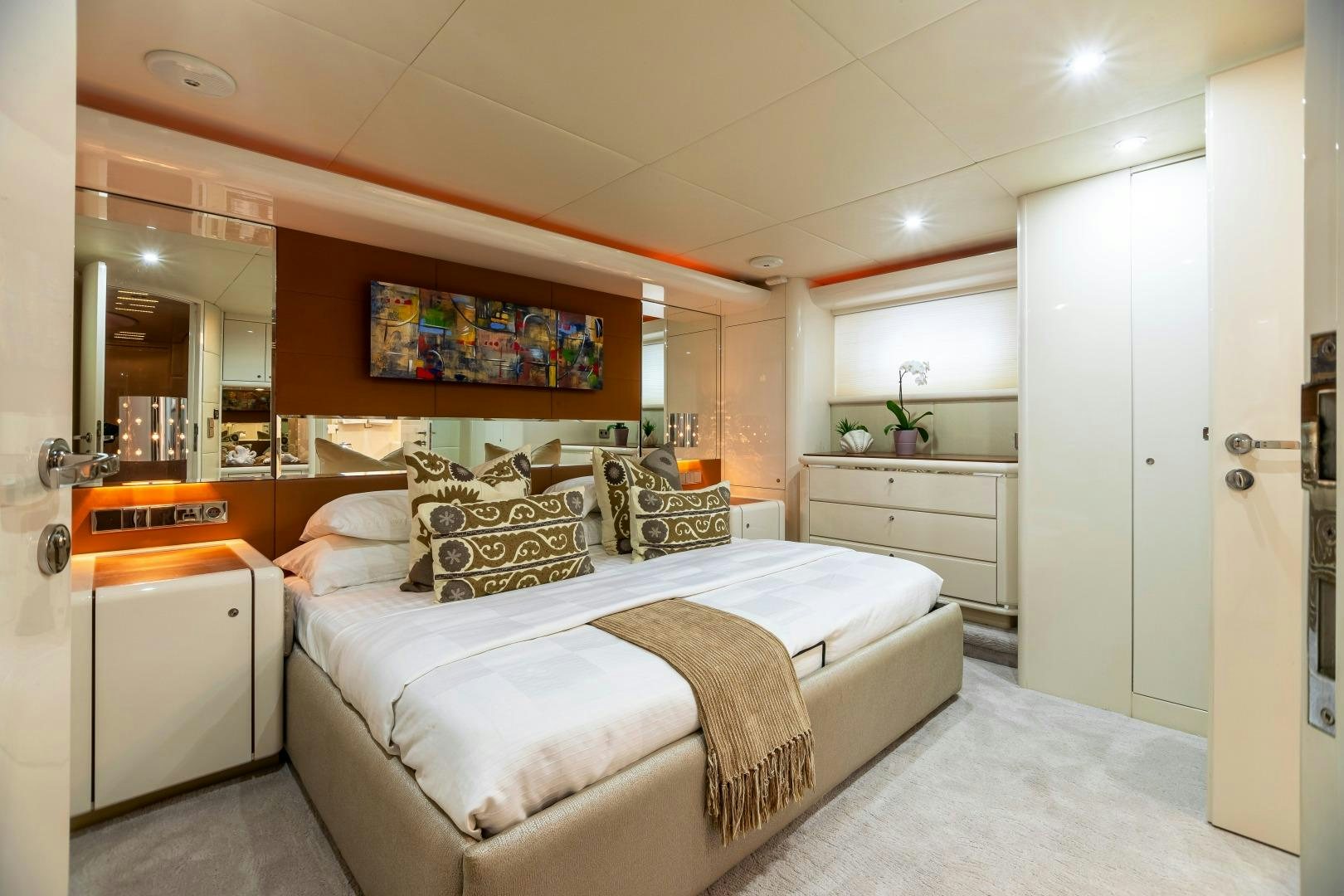 a bedroom with a bed and a television aboard GRANDEUR Yacht for Sale