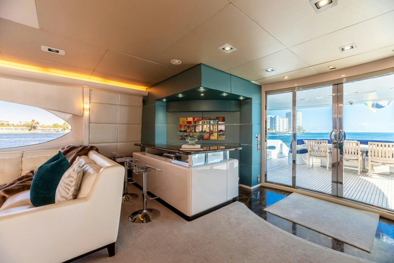 a room with a large window and a view of the ocean aboard GRANDEUR Yacht for Sale