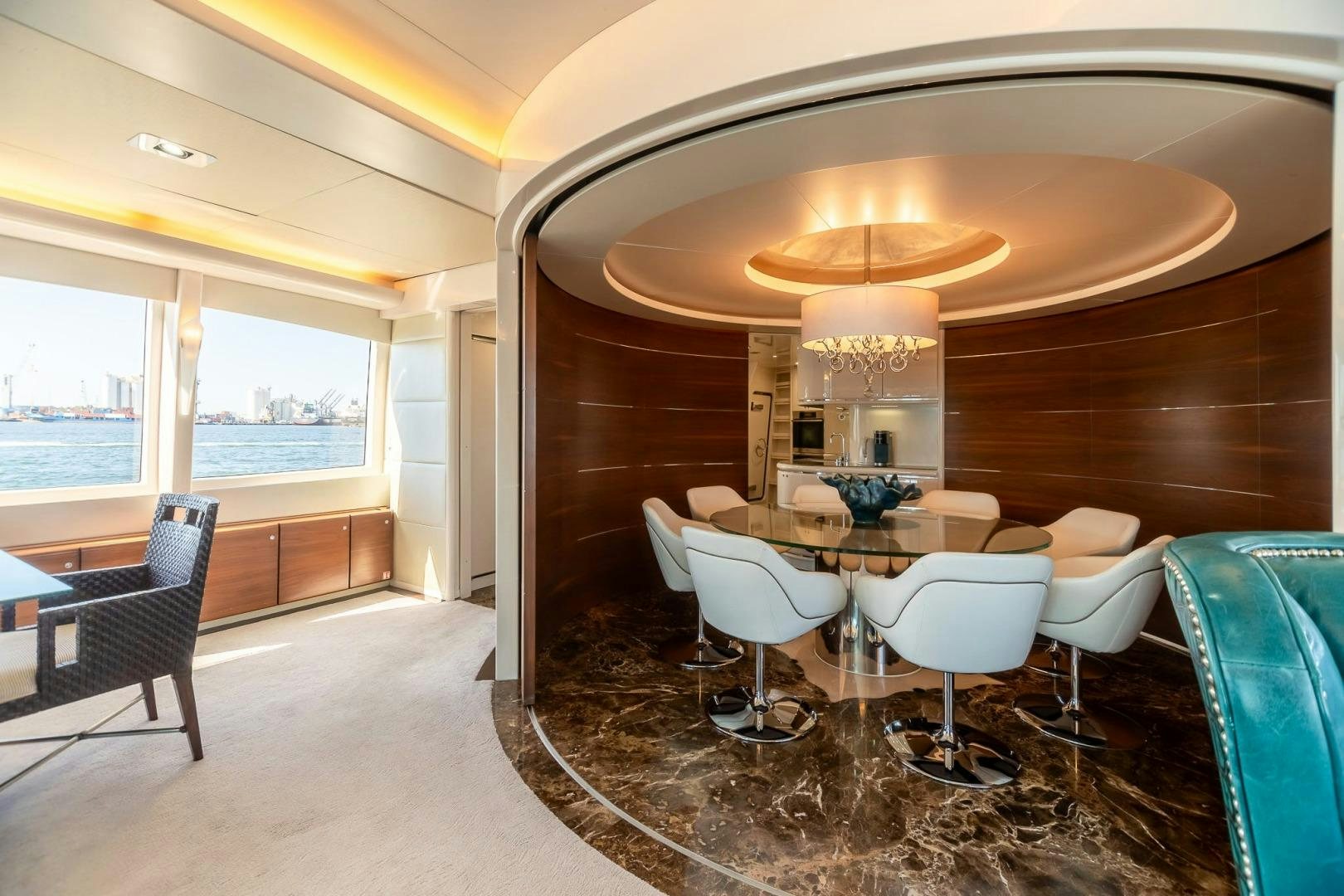 a room with a table chairs and a large window aboard GRANDEUR Yacht for Sale