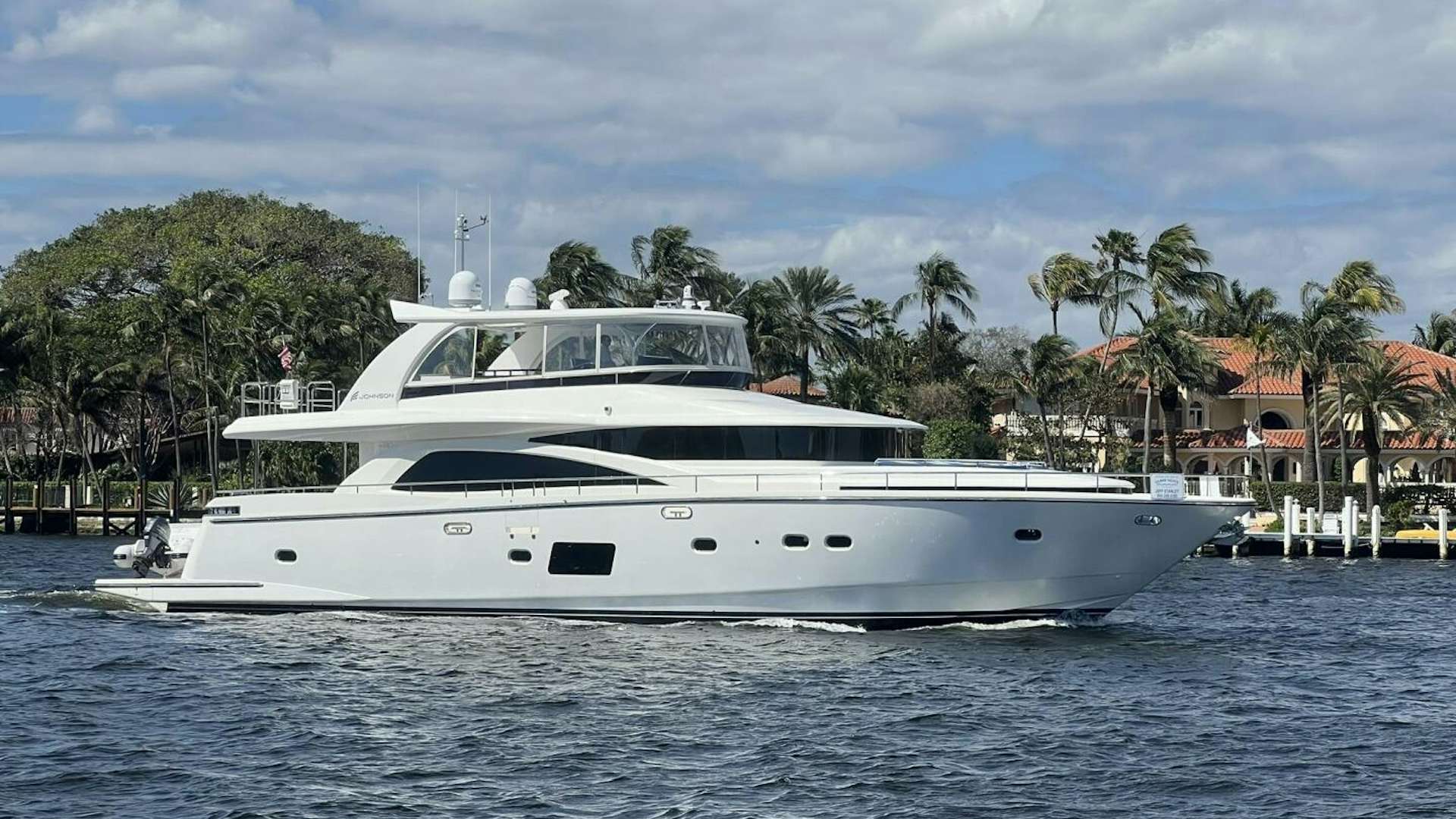 a white yacht in the water aboard DEESCOVERY Yacht for Sale