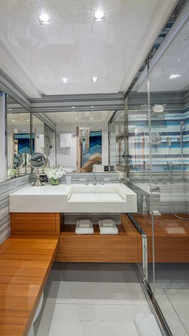a bathroom with a large mirror aboard NAMASTE Yacht for Sale
