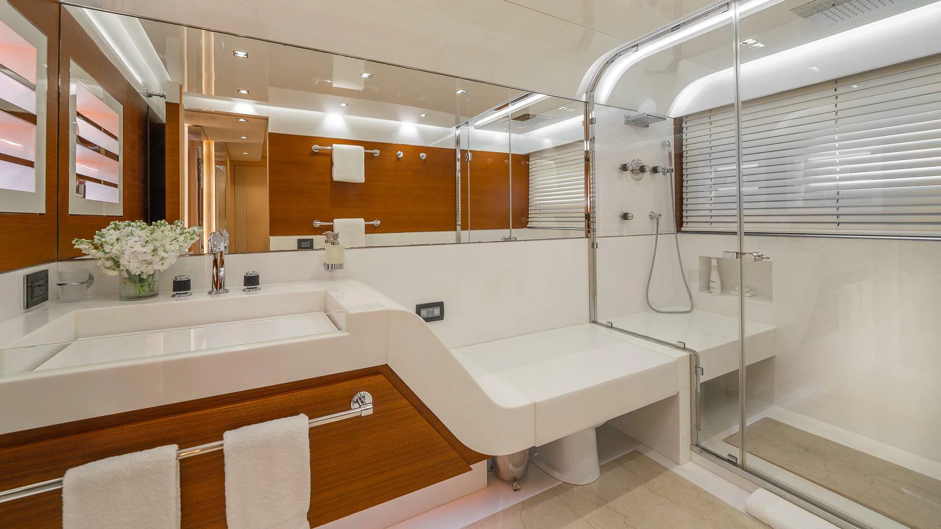 a bathroom with a large mirror aboard NAMASTE Yacht for Sale