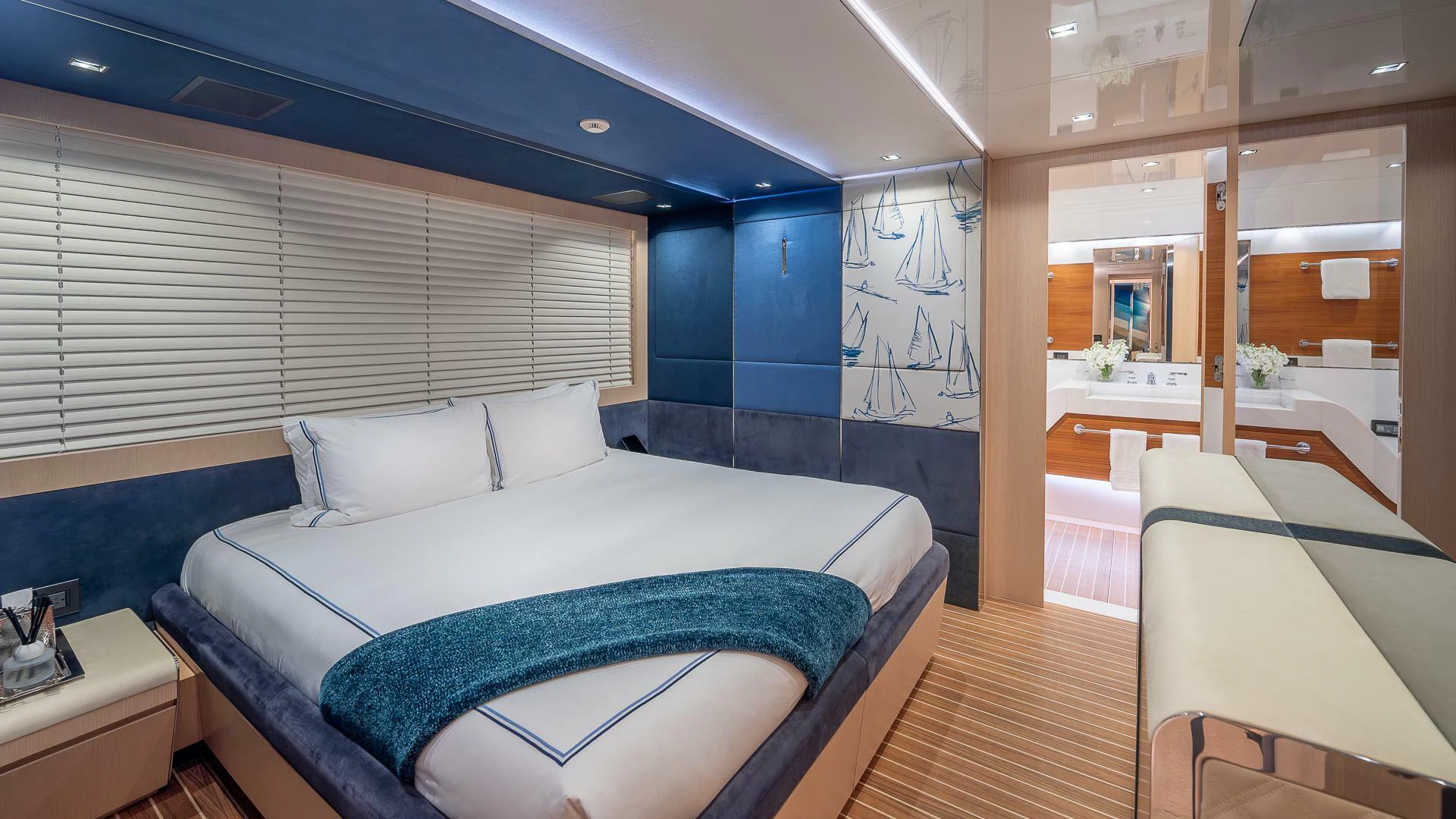 a room with a bed and a window aboard NAMASTE Yacht for Sale