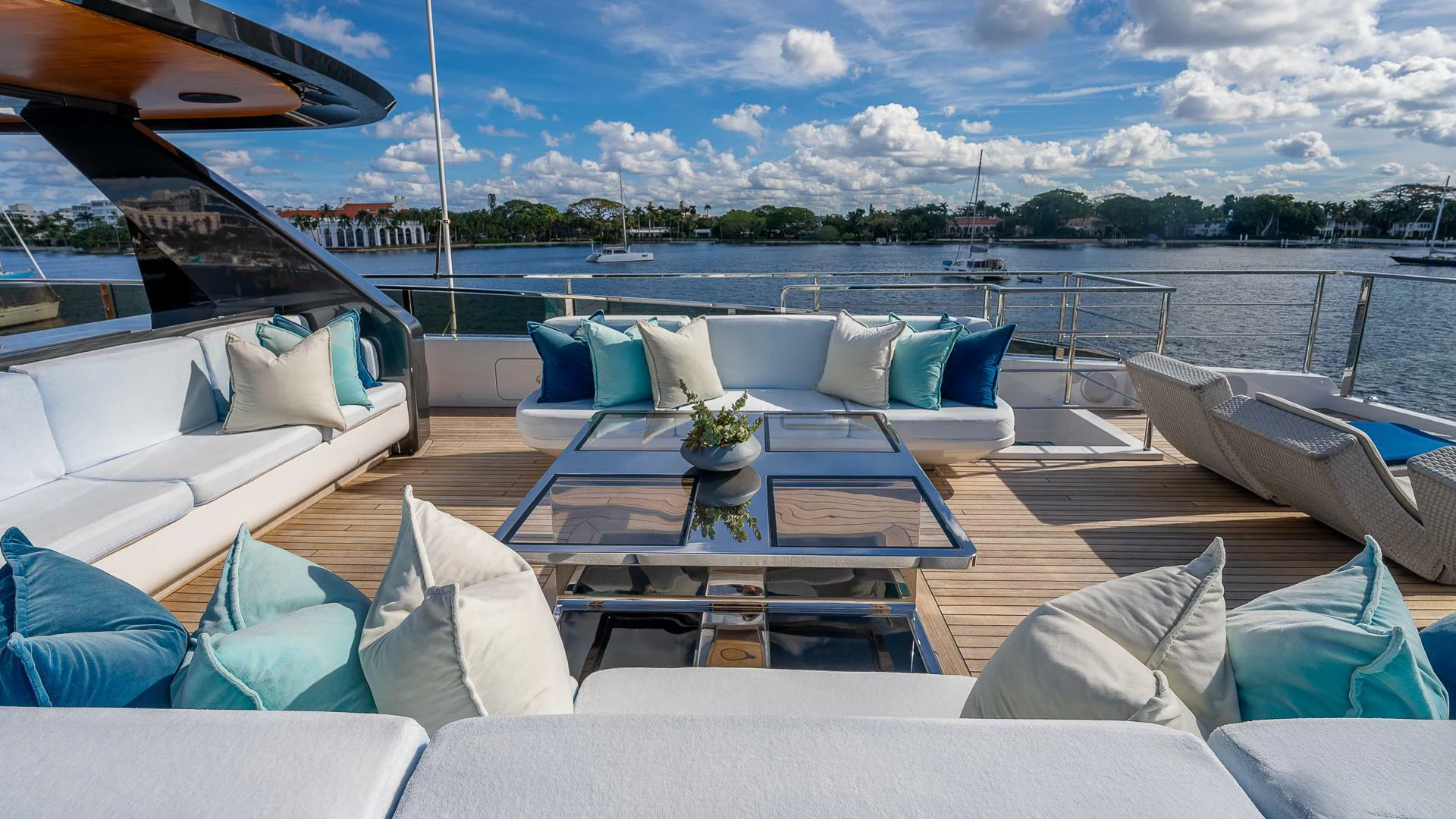 a large patio with a table and chairs on it aboard NAMASTE Yacht for Sale