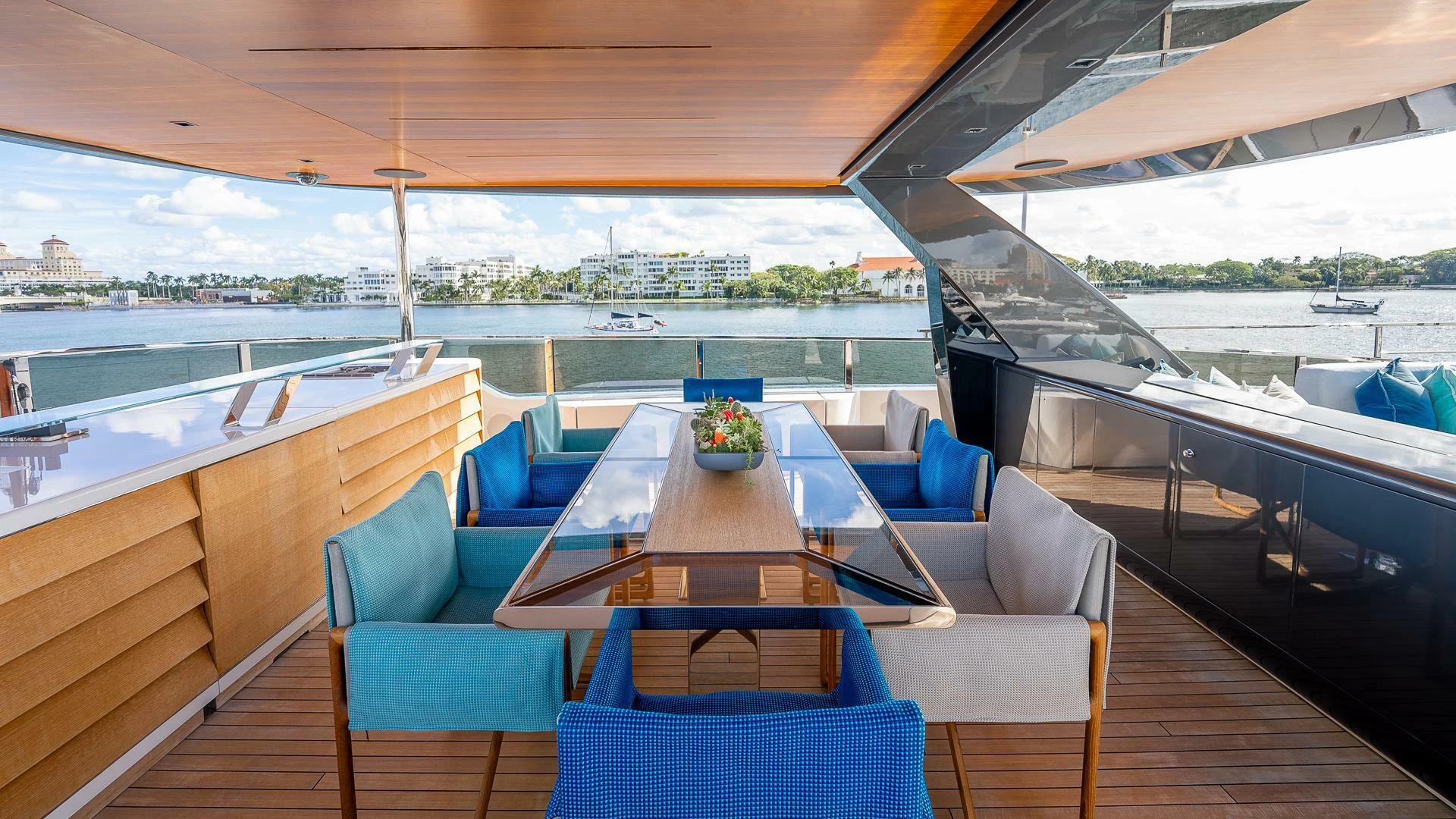 a large patio with a table and chairs on it aboard NAMASTE Yacht for Sale
