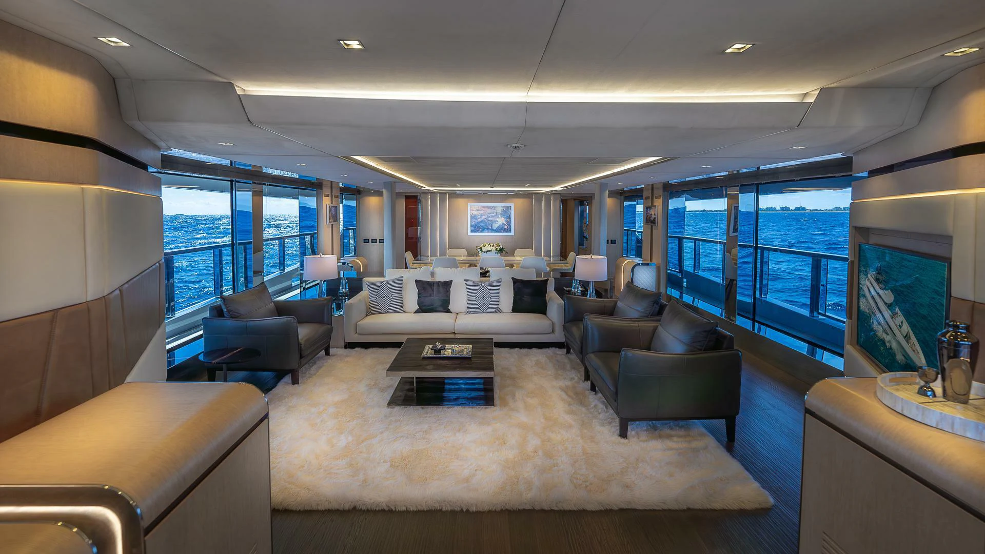 a large living room with a large window aboard NAMASTE Yacht for Sale