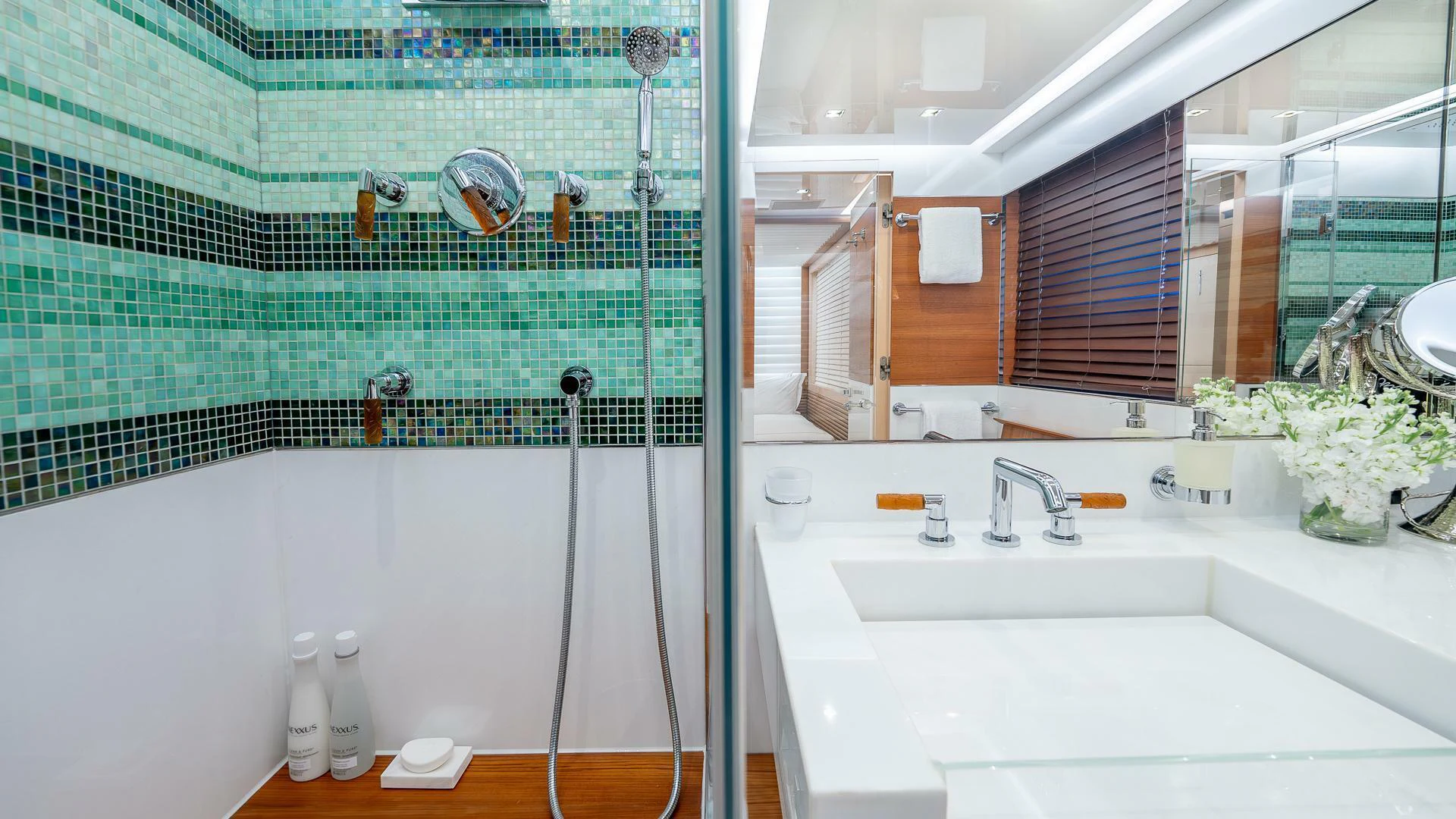 a bathroom with a sink and a mirror aboard NAMASTE Yacht for Sale