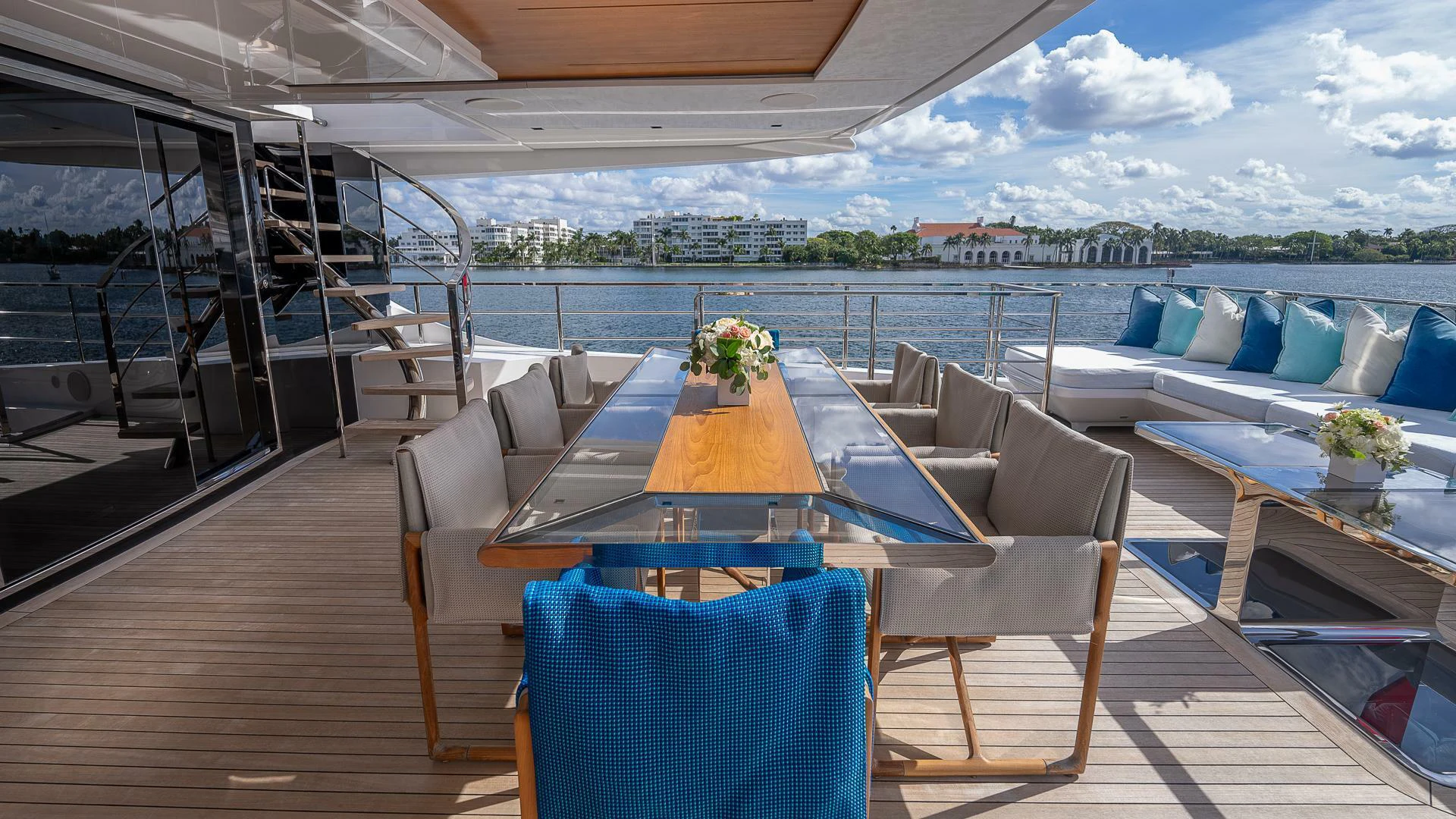 a room with a table chairs and a pool aboard NAMASTE Yacht for Sale
