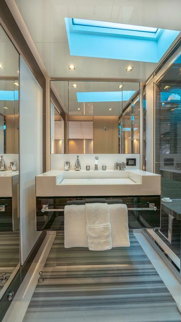 a bathroom with a large mirror aboard NAMASTE Yacht for Sale