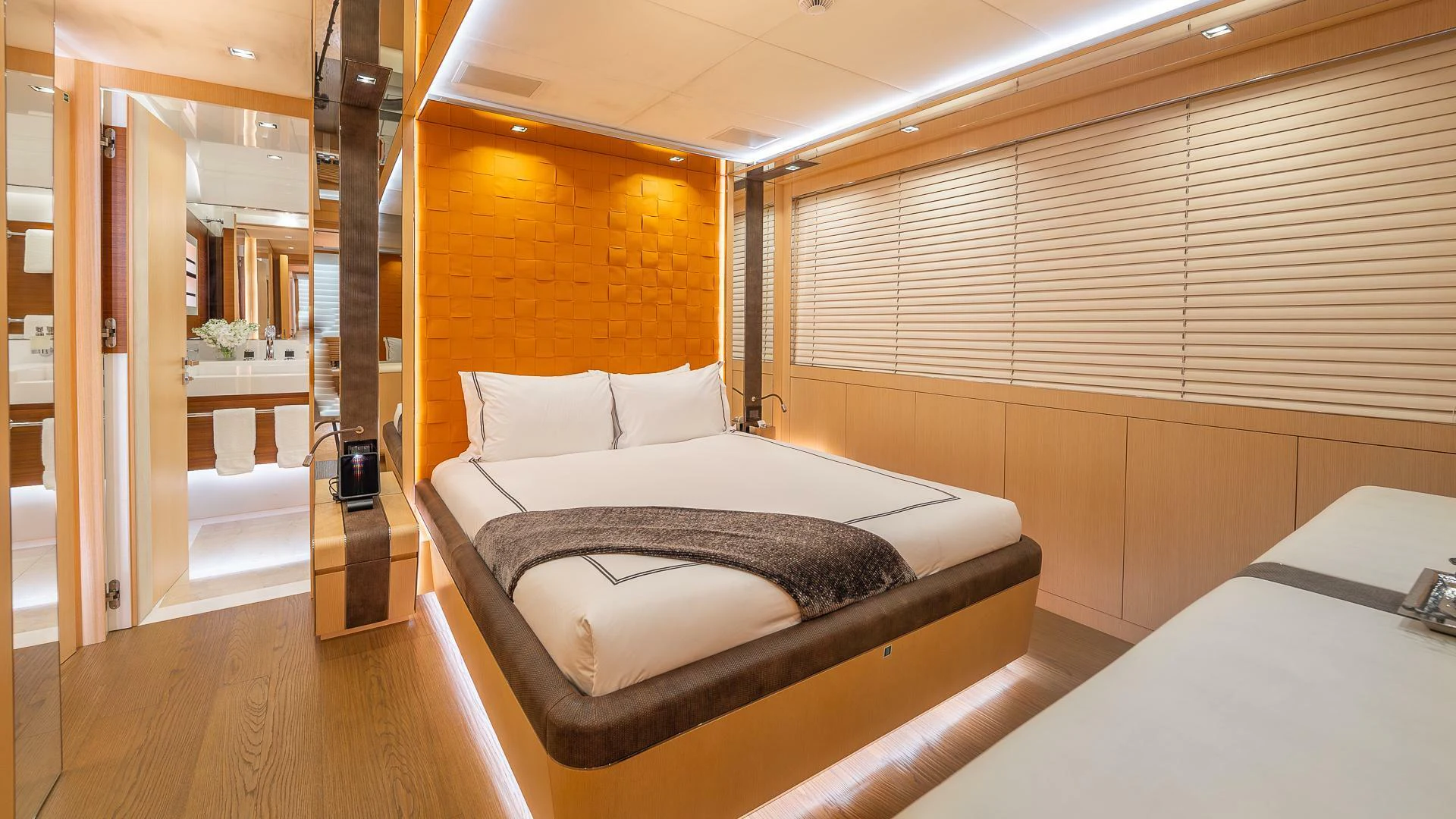 a room with a bed and a desk aboard NAMASTE Yacht for Sale