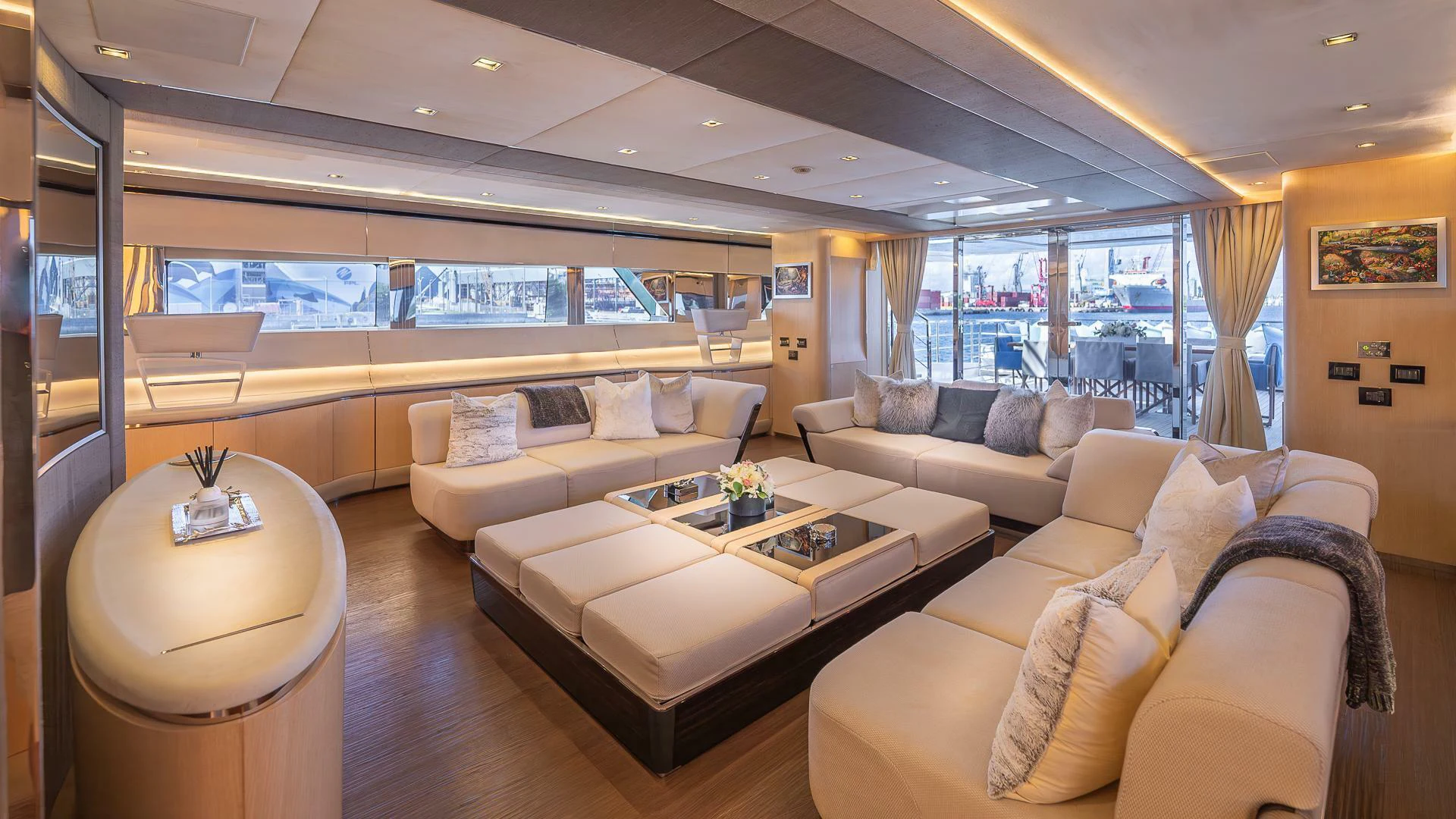 a living room with a couch and a table aboard NAMASTE Yacht for Sale