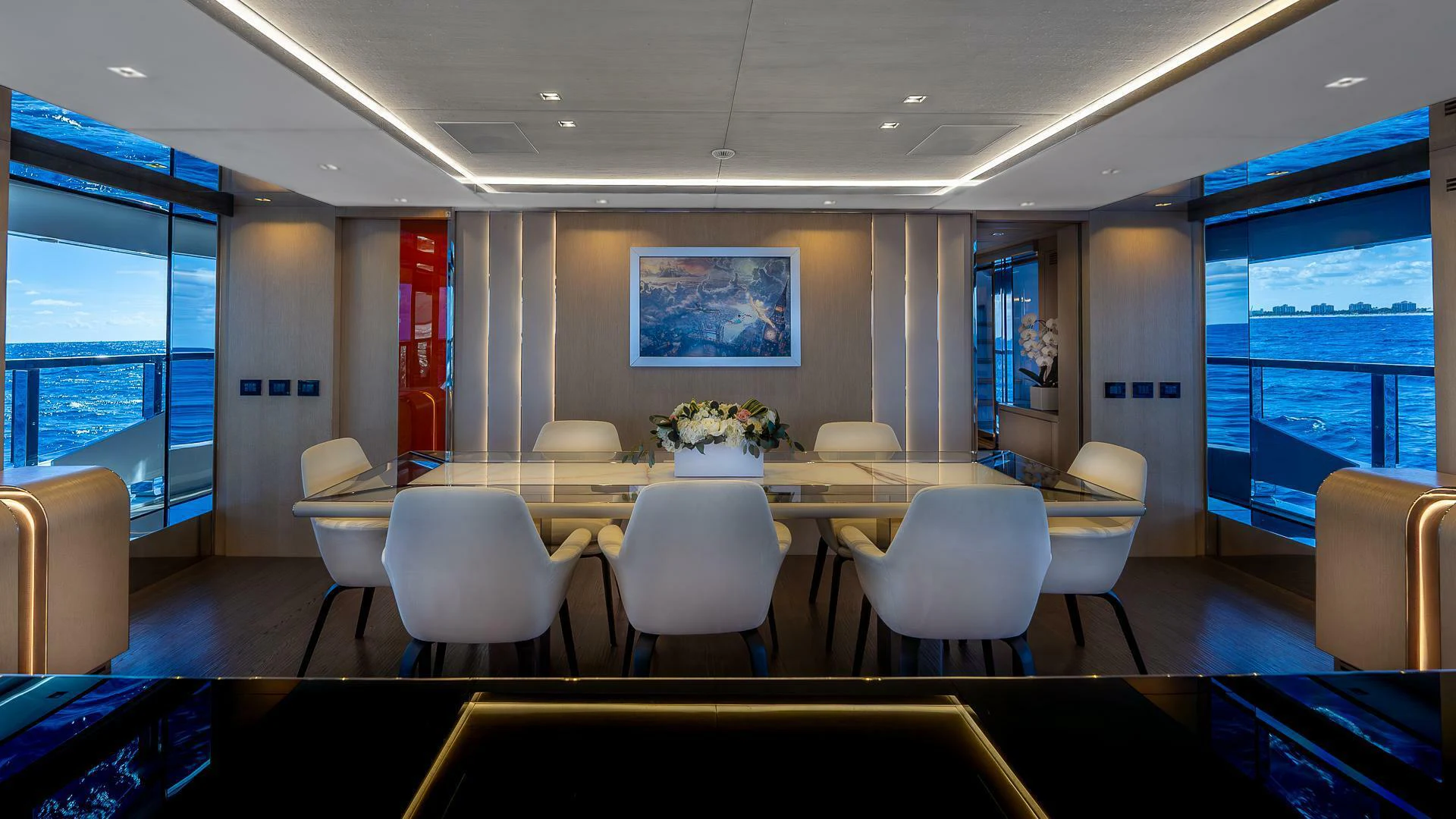 a room with a table chairs and a window aboard NAMASTE Yacht for Sale