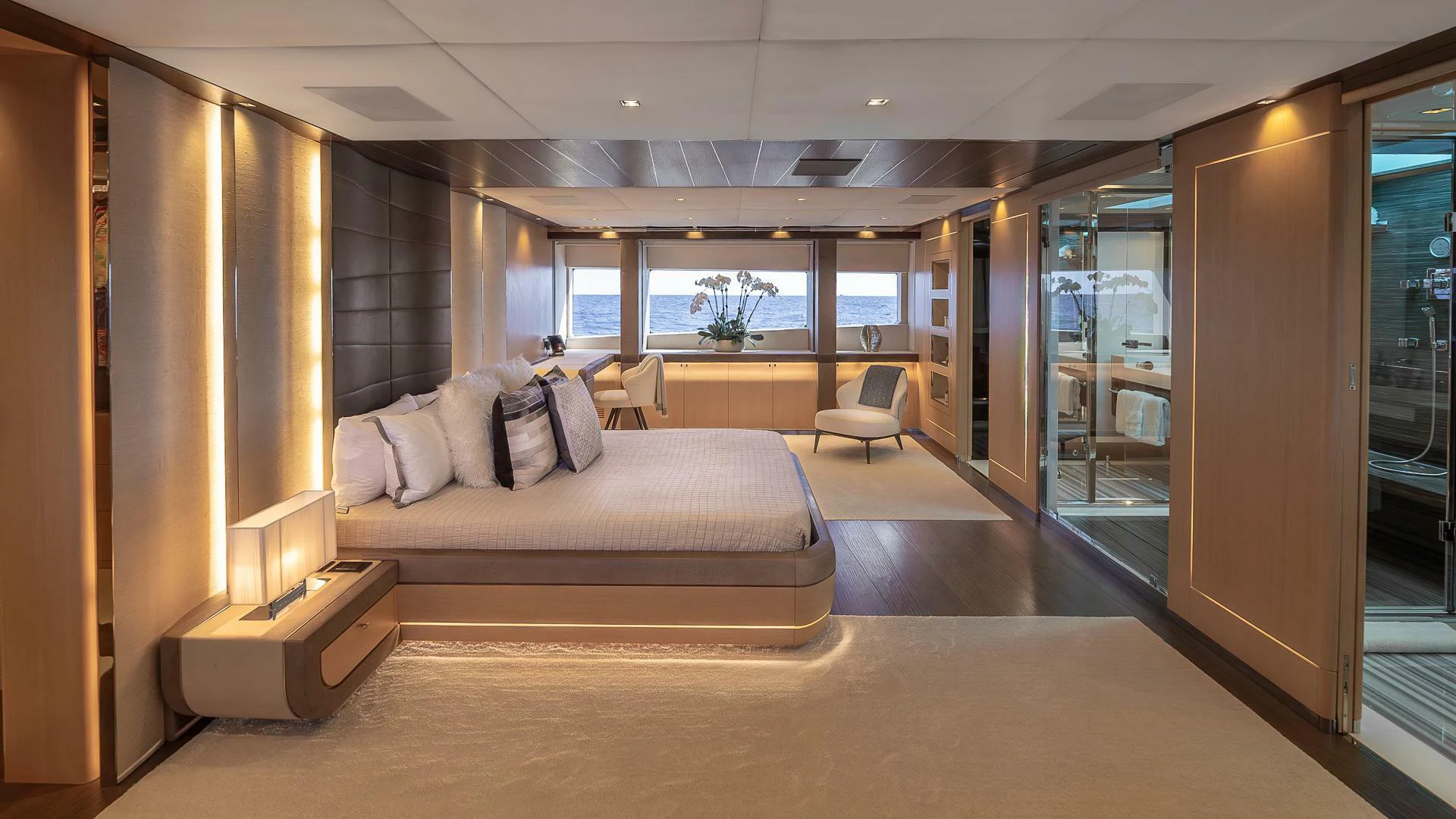 a large room with a bed and a chair aboard NAMASTE Yacht for Sale