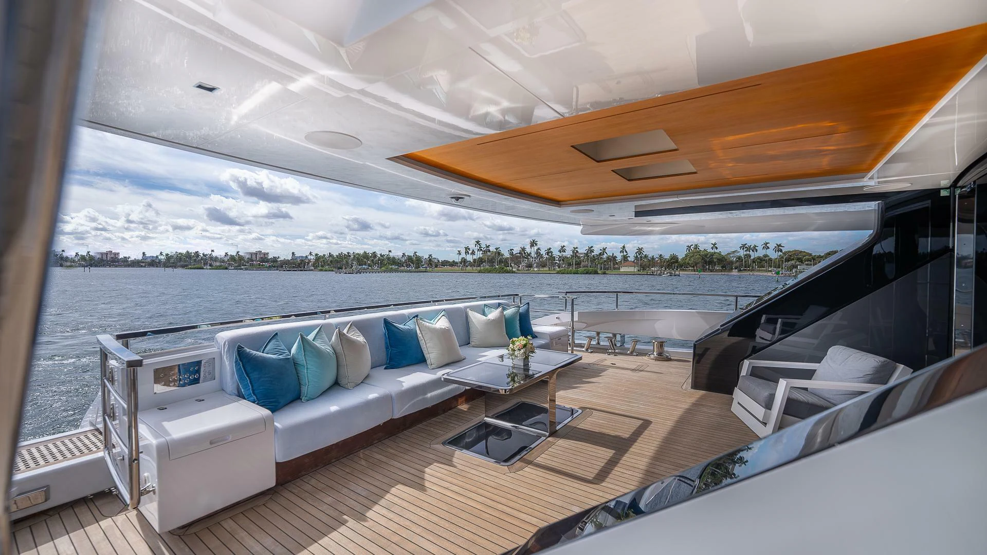 a large white lounge chair in a boat on a body of water aboard NAMASTE Yacht for Sale