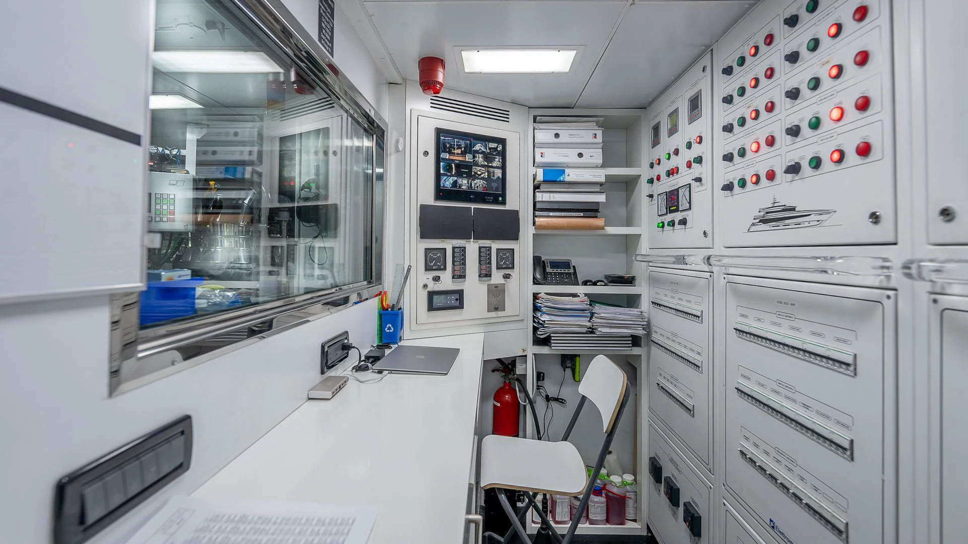 a room with a white desk and computer equipment aboard NAMASTE Yacht for Sale