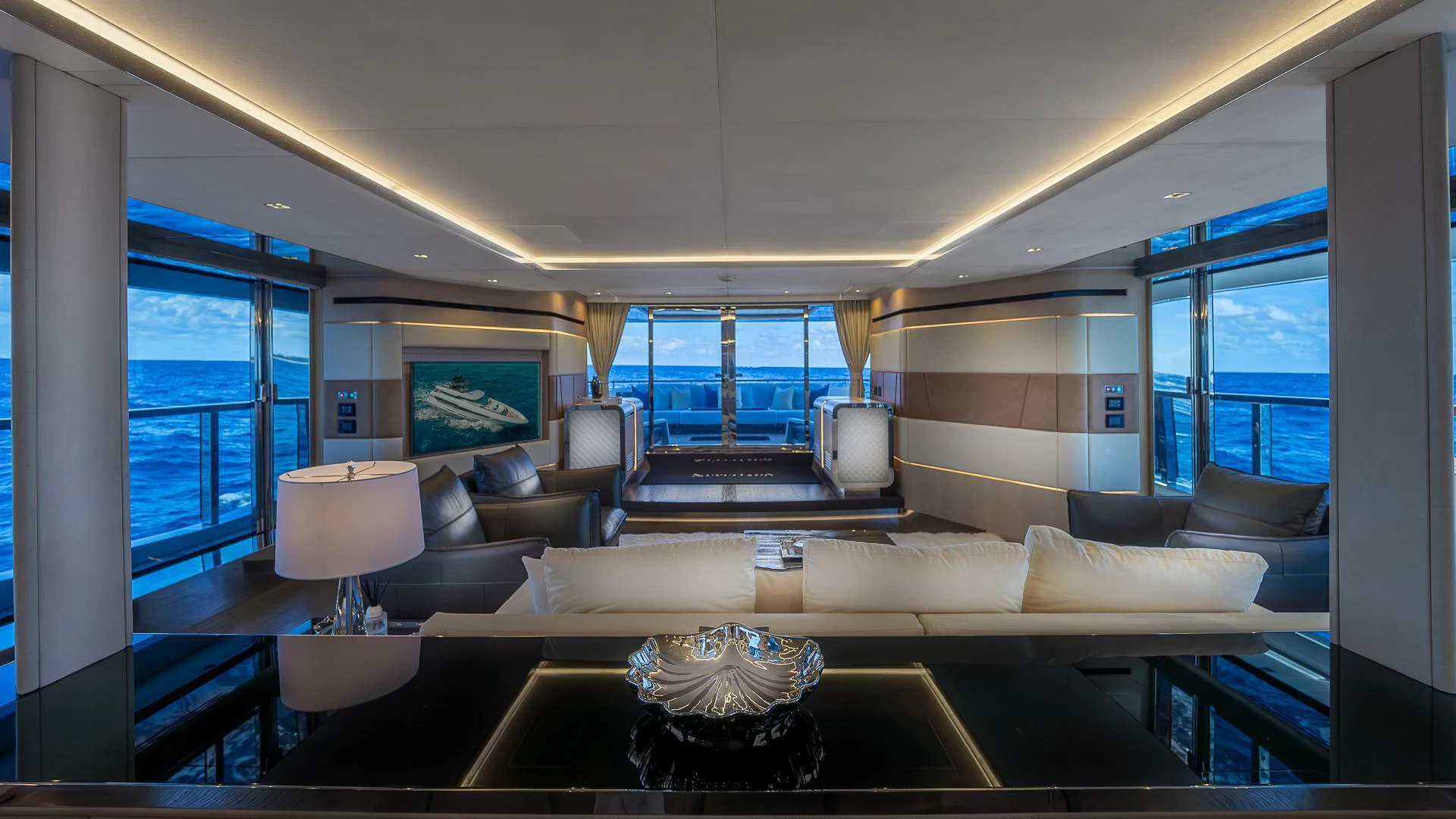 a living room with a large window aboard NAMASTE Yacht for Sale