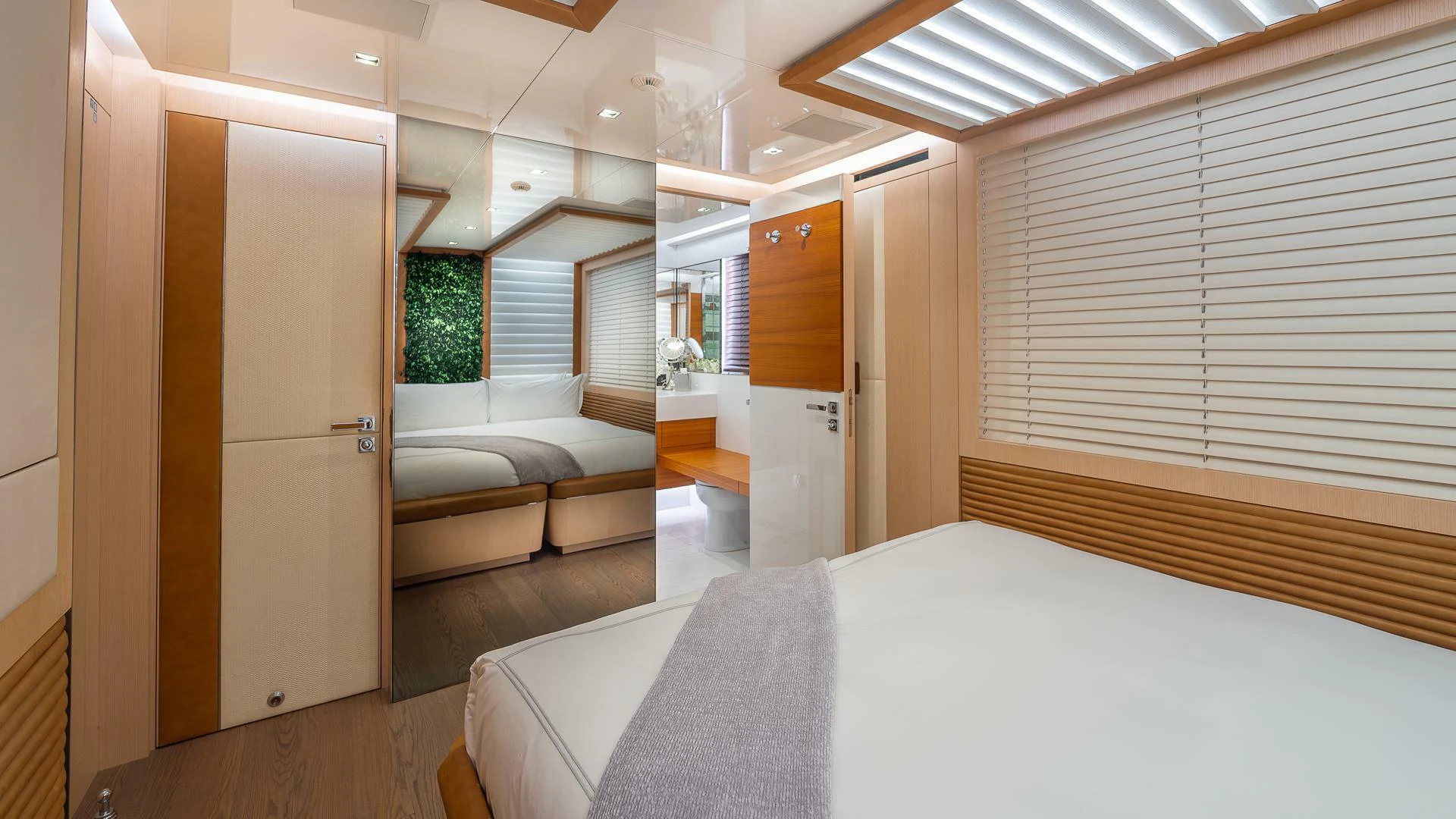 a room with a bed and a couch aboard NAMASTE Yacht for Sale