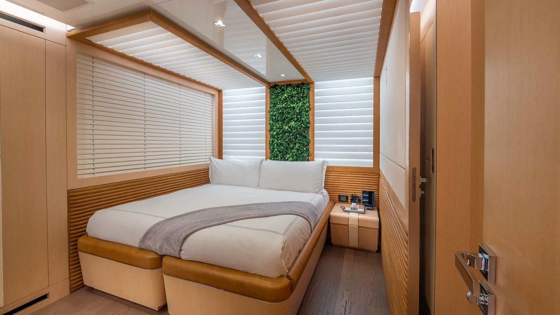 a bed in a room aboard NAMASTE Yacht for Sale