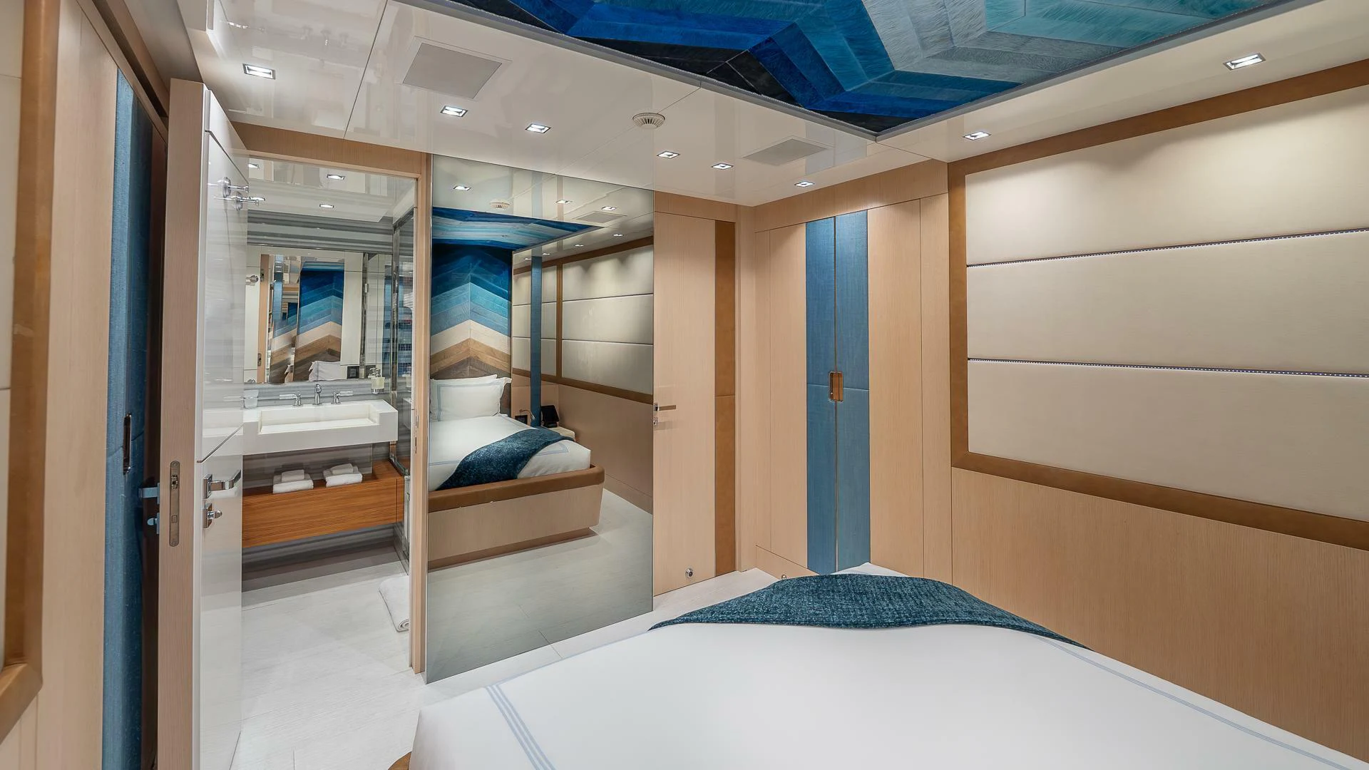 a room with a bed and a closet aboard NAMASTE Yacht for Sale