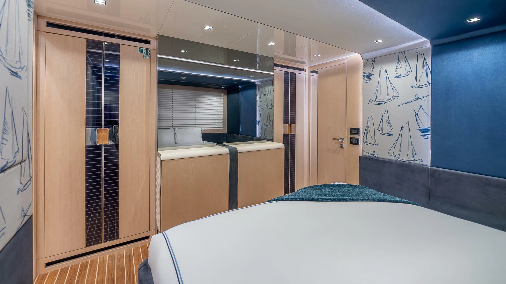a room with a bed and a door aboard NAMASTE Yacht for Sale