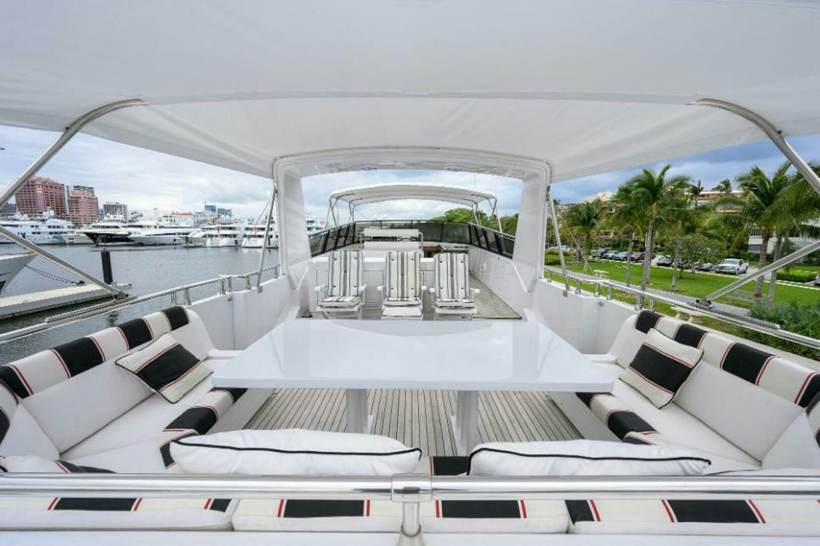 a large white boat with a large deck and a pool aboard CIPANGO Yacht for Sale