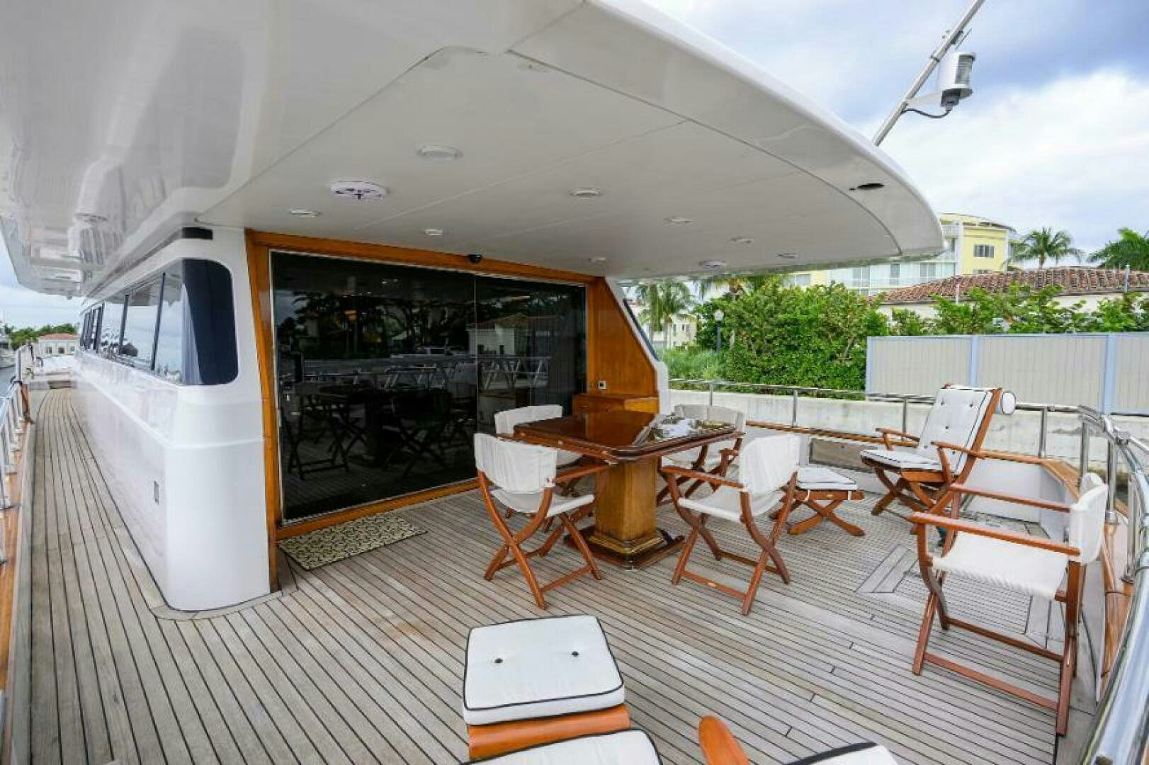 a room with a table and chairs aboard CIPANGO Yacht for Sale