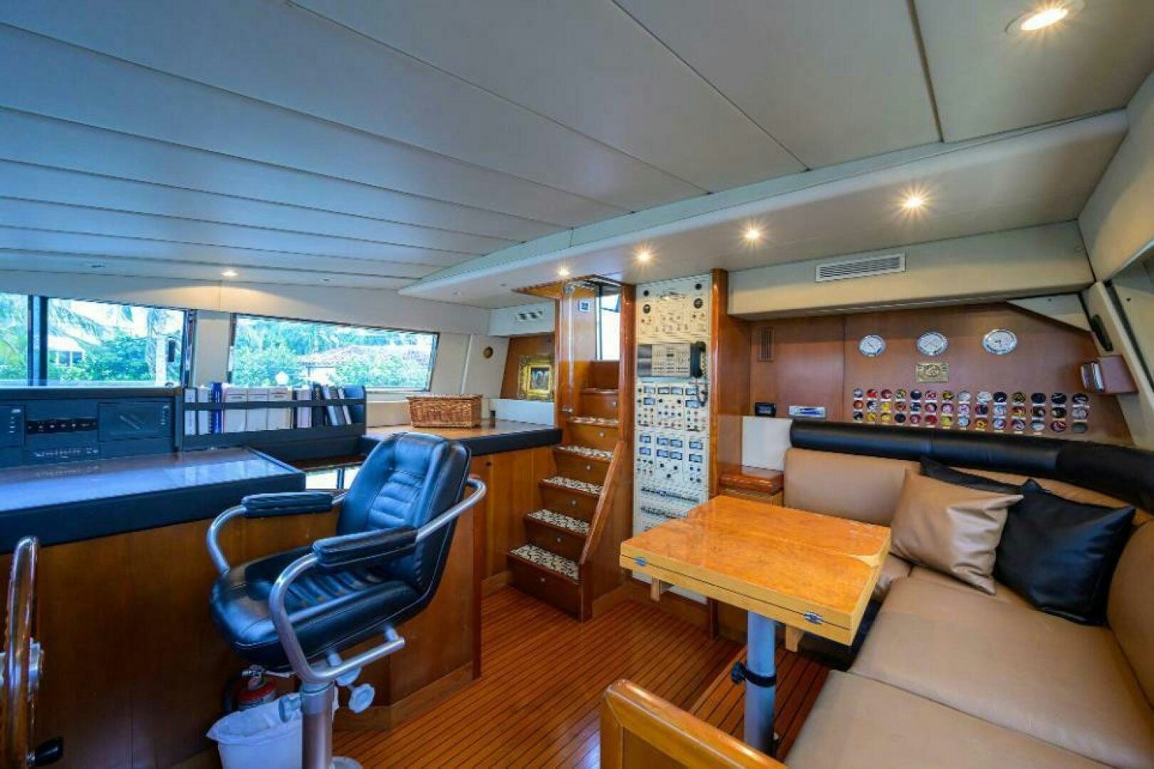 a room with a couch and a table and chairs aboard CIPANGO Yacht for Sale