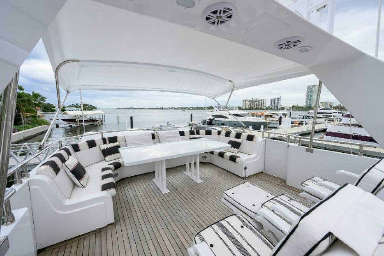 a large white tent with chairs and tables aboard CIPANGO Yacht for Sale
