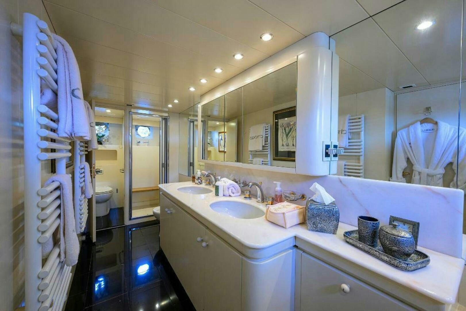 a bathroom with a sink and a mirror aboard CIPANGO Yacht for Sale